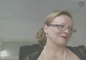 Gorgeous bitch in glasses teasing with her boobies