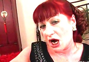 Red-haired older lady worships cock and gets fucked