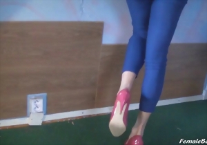 Sensual Asian hottie in blue pants looks good in red high heels